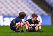 24 October 2023; Rhys Ó Mongaigh Cuidithe, right, is consoled by Gaelscoil Míde teammate Conall Ó Gallachóir after the match between St Joseph's NS Clondalkin and Gaelscoil Míde at the Allianz Cumann na mBunscol Finals at Croke Park in Dublin. Photo by Ben McShane/Sportsfile
