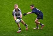 24 October 2023; Aaron Keegan of St Joseph's NS Clondalkin in action against Liam Ó Domhnaill of Gaelscoil Míde during the match between St Joseph's NS Clondalkin and Gaelscoil Míde at the Allianz Cumann na mBunscol Finals at Croke Park in Dublin. Photo by Ben McShane/Sportsfile