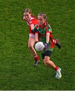 24 October 2023; Lucie Delaney of St Finian's PS Newcastle in action against Lara Toomey of St Benedict's National School during the match between St Benedict's National School and St Finian's PS Newcastle at the Allianz Cumann na mBunscol Finals at Croke Park in Dublin. Photo by Ben McShane/Sportsfile