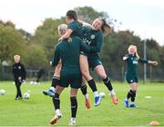 25 October 2023; Lucy Quinn, right, celebrates with Katie McCabe and Louise Quinn, left, during a Republic of Ireland women training session at the FAI National Training Centre in Abbotstown, Dublin. Photo by Stephen McCarthy/Sportsfile