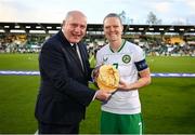 27 October 2023; Republic of Ireland captain Diane Caldwell is presented with a gold cap on the occasion of her 100th Republic of Ireland cap by FAI President Gerry McAnaney before the UEFA Women's Nations League B match between Republic of Ireland and Albania at Tallaght Stadium in Dublin. Photo by Stephen McCarthy/Sportsfile