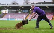 27 October 2023; Groundsman Kevin McCabe spreads sand on the pitch before the SSE Airtricity Men's Premier Division match between Cork City and Derry City at Turner's Cross in Cork. Photo by Eóin Noonan/Sportsfile
