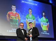 27 October 2023; Jack McCullagh of Carlow receives his 2023 Joe McDonagh Team of the Year award from Uachtarán Chumann Lúthchleas Gael Larry McCarthy during the GAA Champion 15 Awards Croke Park in Dublin. Photo by Matt Browne/Sportsfile