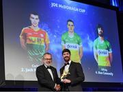 27 October 2023; Ben Conneely of Offaly receives his 2023 Joe McDonagh Team of the Year award from Uachtarán Chumann Lúthchleas Gael Larry McCarthy during the GAA Champion 15 Awards Croke Park in Dublin. Photo by Matt Browne/Sportsfile