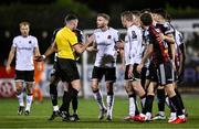 27 October 2023; Players, inclduing Andy Boyle of Dundalk, centre, protest to referee Rob Hennessy during the SSE Airtricity Men's Premier Division match between Dundalk and Bohemians at Oriel Park in Dundalk, Louth. Photo by Ben McShane/Sportsfile