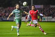 27 October 2023; Richie Towell of Shamrock Rovers in action against David Norman of St Patrick's Athletic during the SSE Airtricity Men's Premier Division match between St Patrick's Athletic and Shamrock Rovers at Richmond Park in Dublin. Photo by Seb Daly/Sportsfile