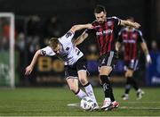 27 October 2023; Paul Doyle of Dundalk in action against Jordan Flores of Bohemians during the SSE Airtricity Men's Premier Division match between Dundalk and Bohemians at Oriel Park in Dundalk, Louth. Photo by Ben McShane/Sportsfile