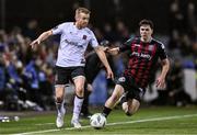 27 October 2023; Paul Doyle of Dundalk in action against James Clarke of Bohemians during the SSE Airtricity Men's Premier Division match between Dundalk and Bohemians at Oriel Park in Dundalk, Louth. Photo by Ben McShane/Sportsfile