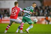 27 October 2023; Graham Burke of Shamrock Rovers in action against Sam Curtis of St Patrick's Athletic during the SSE Airtricity Men's Premier Division match between St Patrick's Athletic and Shamrock Rovers at Richmond Park in Dublin. Photo by Seb Daly/Sportsfile