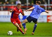 27 October 2023; JJ Lunney of Shelbourne in action against Ciaran Behan of UCD during the SSE Airtricity Men's Premier Division match between Shelbourne and UCD at Tolka Park in Dublin. Photo by Tyler Miller/Sportsfile