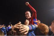 27 October 2023; Jack Moylan of Shelbourne is held aloft by supporters after his side's victory in the SSE Airtricity Men's Premier Division match between Shelbourne and UCD at Tolka Park in Dublin. Photo by Tyler Miller/Sportsfile