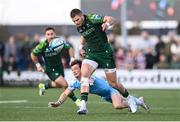 28 October 2023; Byron Ralston of Connacht evades the tackle of George Horne of Glasgow Warriors during the United Rugby Championship match between Connacht and Glasgow Warriors at The Sportsground in Galway. Photo by Ramsey Cardy/Sportsfile