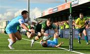 28 October 2023; Diarmuid Kilgallen of Connacht dives over to score his side's first try despite the tackle of Huw Jones of Glasgow Warriors during the United Rugby Championship match between Connacht and Glasgow Warriors at The Sportsground in Galway. Photo by Ramsey Cardy/Sportsfile