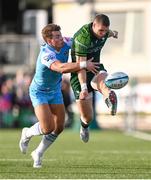 28 October 2023; Diarmuid Kilgallen of Connacht kicks under pressure from Huw Jones of Glasgow Warriors during the United Rugby Championship match between Connacht and Glasgow Warriors at The Sportsground in Galway. Photo by Ramsey Cardy/Sportsfile