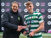 28 October 2023; James Stefan Roche of Shamrock Rovers is presented with the Player of the Match award by Republic of Ireland men's U17 head coach Colin O’Brien after the EA SPORTS MU17 LOI Mark Farren Cup match between Shamrock Rovers and Shelbourne at Tallaght Stadium in Dublin. Photo by Tyler Miller/Sportsfile