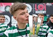 28 October 2023; Ryan Ritchie of Shamrock Rovers celebrates with the cup after his side's victory in the EA SPORTS MU17 LOI Mark Farren Cup match between Shamrock Rovers and Shelbourne at Tallaght Stadium in Dublin. Photo by Tyler Miller/Sportsfile