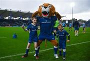 28 October 2023; Leo the Lion with matchday mascots Samuel Bayley, aged nine, and Harry Cronin, aged seven, before the United Rugby Championship match between Leinster and Hollywoodbets Sharks at the RDS Arena in Dublin. Photo by Harry Murphy/Sportsfile