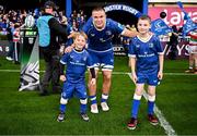 28 October 2023; Leinster captain Scott Penny walks out with matchday mascots Harry Cronin, aged seven, and Samuel Bayley, aged nine, before the United Rugby Championship match between Leinster and Hollywoodbets Sharks at the RDS Arena in Dublin. Photo by Harry Murphy/Sportsfile