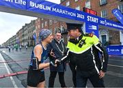 29 October 2023; The Lord Mayor's Medal Recipient Rita Casey from Mayo, left, shakes hands with Pearse Street Garda Station Superintendent Dermott McKenna before the 2023 Irish Life Dublin Marathon. Thousands of runners took to the Fitzwilliam Square start line, to participate in the 42nd running of the Dublin Marathon. Photo by Sam Barnes/Sportsfile *** NO REPRODUCTION FEE **