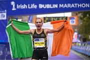 29 October 2023; Irish Women's Champion Ann-Marie McGlynn celebrates after the 2023 Irish Life Dublin Marathon. Thousands of runners took to the Fitzwilliam Square start line, to participate in the 42nd running of the Dublin Marathon. Photo by Sam Barnes/Sportsfile