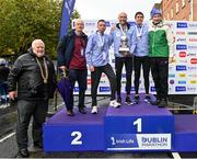 29 October 2023; Pictured, from left, at the Men's National Championship podium, Athletics Ireland President John Cronin, Irish Sports Council Chief Executive and Olympian John Treacy, second place Ryan Creech from Cork, first place Stephen Scullion, third place Ryan Forsyth from Tipperary, and Race Director Jim Aughney after the 2023 Irish Life Dublin Marathon. Thousands of runners took to the Fitzwilliam Square start line, to participate in the 42nd running of the Dublin Marathon. Photo by Sam Barnes/Sportsfile