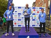 29 October 2023; Men's National Championship podium, from left, second place Ryan Creech from Cork, first place Stephen Scullion, and third place Ryan Forsyth from Tipperary, during the 2023 Irish Life Dublin Marathon. Thousands of runners took to the Fitzwilliam Square start line, to participate in the 42nd running of the Dublin Marathon. Photo by Sam Barnes/Sportsfile