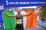 29 October 2023; Women's National Champion Ann-Marie McGlynn celebrates after the 2023 Irish Life Dublin Marathon. Thousands of runners took to the Fitzwilliam Square start line, to participate in the 42nd running of the Dublin Marathon. Photo by Sam Barnes/Sportsfile