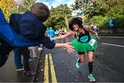 29 October 2023; Kelly McLay and 3 year old CJ Reynolds, from Chapelizod, Dublin, during the 2023 Irish Life Dublin Marathon. Thousands of runners took to the Fitzwilliam Square start line, to participate in the 42nd running of the Dublin Marathon. Photo by Ramsey Cardy/Sportsfile