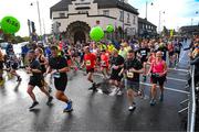 29 October 2023; Participants following a 4:10 pace pass through Terenure during the 2023 Irish Life Dublin Marathon. Thousands of runners took to the Fitzwilliam Square start line, to participate in the 42nd running of the Dublin Marathon. Photo by Ray McManus/Sportsfile