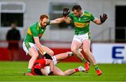 29 October 2023; Paddy McLarnon of O'Donovan Rossa is tackled by Conor Glass, left, and Emmett Bradley of Glen during the Derry County Senior Club Football Championship final match between Glen and O'Donovan Rossa at Celtic Park in Derry. Photo by Ben McShane/Sportsfile