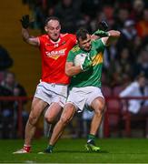 29 October 2023; Michael Warnock of Glen in action against Shane Heavron of O'Donovan Rossa during the Derry County Senior Club Football Championship final match between Glen and O'Donovan Rossa at Celtic Park in Derry. Photo by Ben McShane/Sportsfile