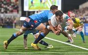 29 October 2023; Jacob Stockdale of Ulster dives over to score his side's second try despite the efforts of Sebastian De Klerk of Vodacom Bulls during the United Rugby Championship match between Ulster and Vodacom Bulls at Kingspan Stadium in Belfast. Photo by Tyler Miller/Sportsfile