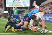 29 October 2023; Jacob Stockdale of Ulster dives over to score his side's second try despite the efforts of Sebastian De Klerk of Vodacom Bulls during the United Rugby Championship match between Ulster and Vodacom Bulls at Kingspan Stadium in Belfast. Photo by Tyler Miller/Sportsfile