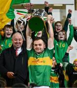 29 October 2023; Glen captain Connor Carville lifts the cup after the Derry County Senior Club Football Championship final match between Glen and O'Donovan Rossa at Celtic Park in Derry. Photo by Ben McShane/Sportsfile