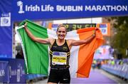 29 October 2023; Women's National Champion Ann-Marie McGlynn celebrates after the 2023 Irish Life Dublin Marathon. Thousands of runners took to the Fitzwilliam Square start line, to participate in the 42nd running of the Dublin Marathon. Photo by Sam Barnes/Sportsfile