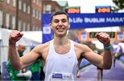 29 October 2023; Michael Boland from Dublin 15,  celebrates finishing the 2023 Irish Life Dublin Marathon. Thousands of runners took to the Fitzwilliam Square start line, to participate in the 42nd running of the Dublin Marathon. Photo by Sam Barnes/Sportsfile