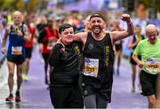 29 October 2023; Eamon Carthy from Dublin 11, crosses the line with his son Cian, after running the 2023 Irish Life Dublin Marathon. Thousands of runners took to the Fitzwilliam Square start line, to participate in the 42nd running of the Dublin Marathon. Photo by Sam Barnes/Sportsfile