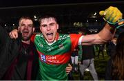 29 October 2023; Frank Irwin of Ballina Stephenites celebrates with a supporter after his side's victory in the Mayo County Senior Club Football Championship final match between Ballina Stephenites and Breaffy at Hastings Insurance MacHale Park in Castlebar, Mayo. Photo by Piaras Ó Mídheach/Sportsfile