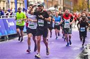 29 October 2023; Rossa Malone from Dublin 3, celebrates finishing the 2023 Irish Life Dublin Marathon. Thousands of runners took to the Fitzwilliam Square start line, to participate in the 42nd running of the Dublin Marathon. Photo by Sam Barnes/Sportsfile