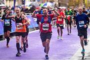 29 October 2023; Paul De Freine from Dublin, left, and Andrew Clarges from Kildare, celebrate finishing the 2023 Irish Life Dublin Marathon. Thousands of runners took to the Fitzwilliam Square start line, to participate in the 42nd running of the Dublin Marathon. Photo by Sam Barnes/Sportsfile