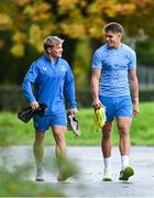 30 October 2023; Leinster players Fintan Gunne, left, and Aitzol Kingarrive befroe Leinster Rugby squad training session at UCD in Dublin. Photo by Sam Barnes/Sportsfile
