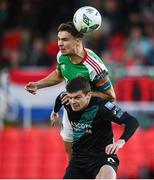 30 October 2023; Cian Coleman of Cork City in action against Lee Grace of Shamrock Rovers during the SSE Airtricity Premier Division match between Cork City and Shamrock Rovers at Turner's Cross in Cork. Photo by David Fitzgerald/Sportsfile