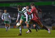 30 October 2023; John O'Sullivan of Shamrock Rovers in action against Brian Cunningham of Galway United during the EA SPORTS MU19 LOI Enda McGuill Cup match between Galway United and Shamrock Rovers at Eamonn Deacy Park in Galway. Photo by Ben McShane/Sportsfile