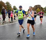 29 October 2023; Sinéad Simpson, with her guide Matt Simpson during the 2023 Irish Life Dublin Marathon. Thousands of runners took to the Fitzwilliam Square start line, to participate in the 42nd running of the Dublin Marathon. Photo by Ramsey Cardy/Sportsfile