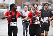 29 October 2023; Lola Folorunso, left, and Rebecca Kidney from Dublin 3, during the 2023 Irish Life Dublin Marathon. Thousands of runners took to the Fitzwilliam Square start line, to participate in the 42nd running of the Dublin Marathon. Photo by Ramsey Cardy/Sportsfile