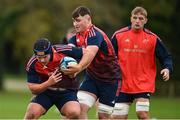 31 October 2023; George Hadden is tackled by Ruadhan Quinn during Munster rugby squad training at the University of Limerick in Limerick. Photo by Brendan Moran/Sportsfile