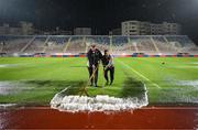 31 October 2023; Groundstaff clear the surface water from the pitch at half-time of the UEFA Women's Nations League B match between Albania and Republic of Ireland at Loro Boriçi Stadium in Shkoder, Albania. Photo by Stephen McCarthy/Sportsfile