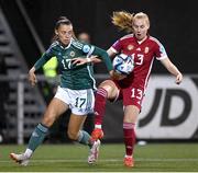 31 October 2023; Emoke Pápai of Hungary in action against Laura Rafferty of Northern Ireland during the UEFA Women's Nations League B match between Northern Ireland and Hungary at Seaview in Belfast. Photo by Ramsey Cardy/Sportsfile