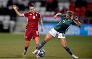 31 October 2023; Viktória Szabó of Hungary in action against Caragh Hamilton of Northern Ireland during the UEFA Women's Nations League B match between Northern Ireland and Hungary at Seaview in Belfast. Photo by Ramsey Cardy/Sportsfile