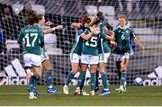 31 October 2023; Northern Ireland players celebrate their side's first goal, scored by Danielle Maxwell, 15, during the UEFA Women's Nations League B match between Northern Ireland and Hungary at Seaview in Belfast. Photo by Ramsey Cardy/Sportsfile